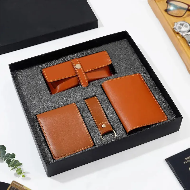 Premium leather corporate gift set with wallet sunglasses case passport cover and keychain for executive business gifting in bulk events and promotions.
