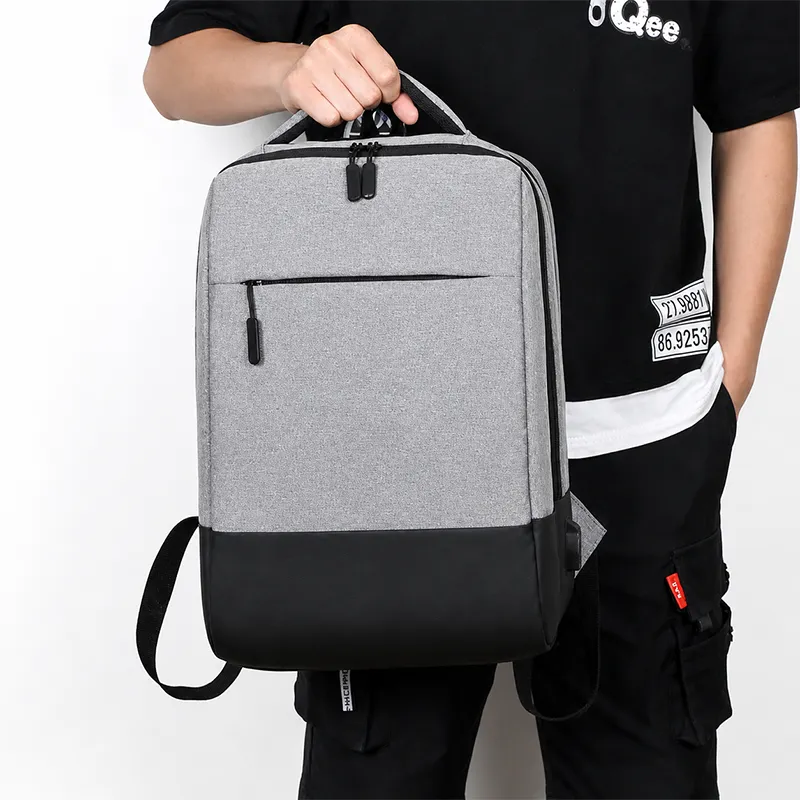 Premium grey laptop backpack manufacturer India with USB charging for bulk corporate gifting in events, promotions, IT tech companies & Businesses