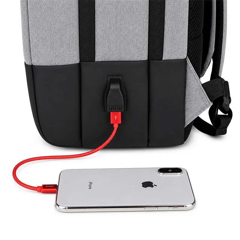 Premium grey laptop backpack manufacturer India with USB charging for bulk corporate gifting in events, promotions, IT tech companies & Businesses